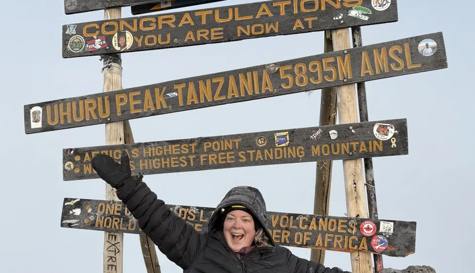 Megan Wheatley at the top of Mount Kilimanjaro
